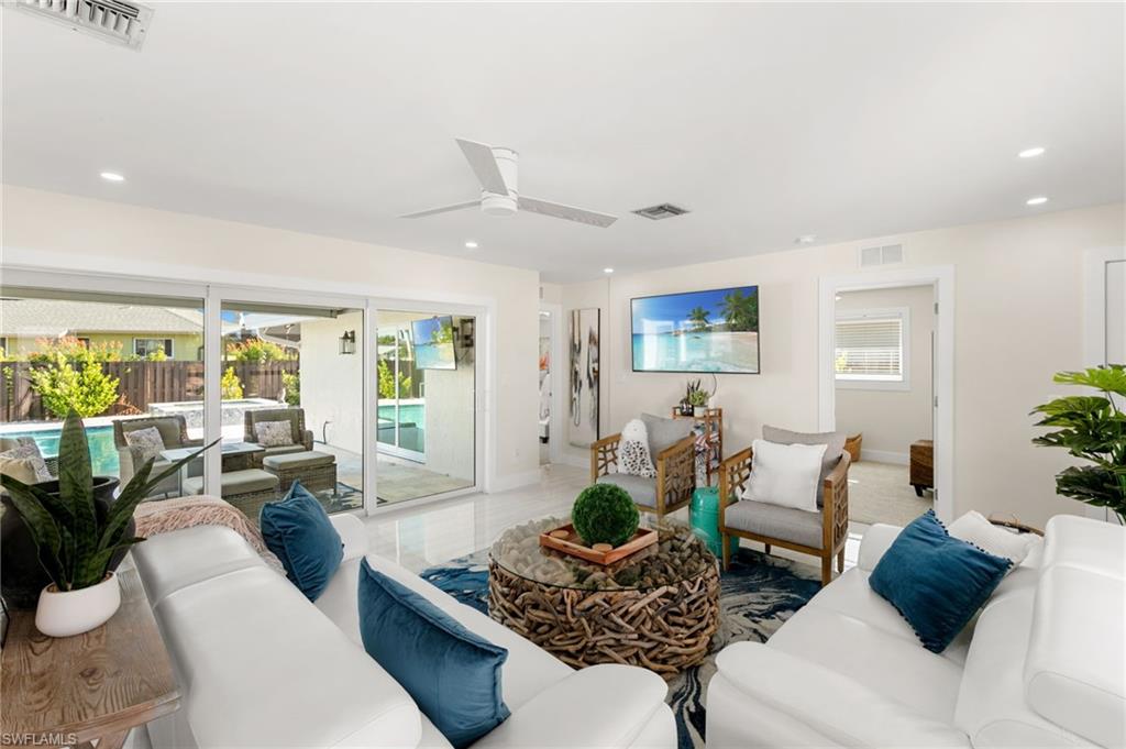 321 Columbus Way Marco Island, FL 34145 - Photo 5 of 40 Living area featuring healthy amount of natural light, ceiling fan, and recessed lighting