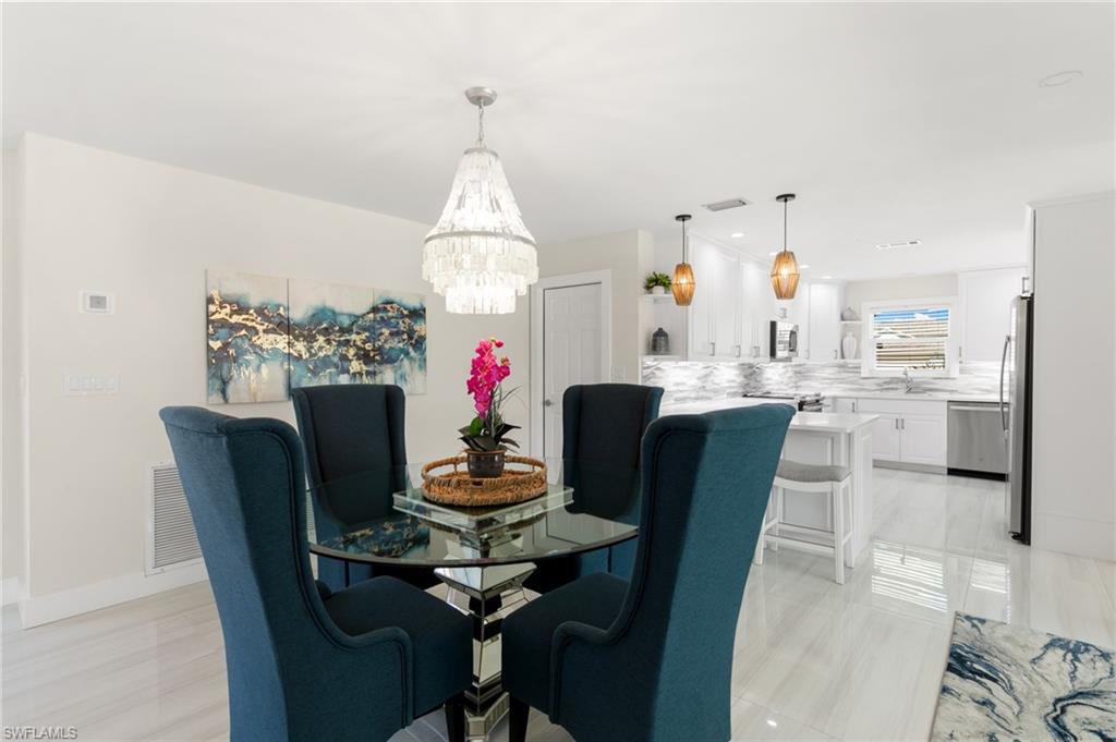 321 Columbus Way Marco Island, FL 34145 - Photo 8 of 40 Dining room with a chandelier and recessed lighting