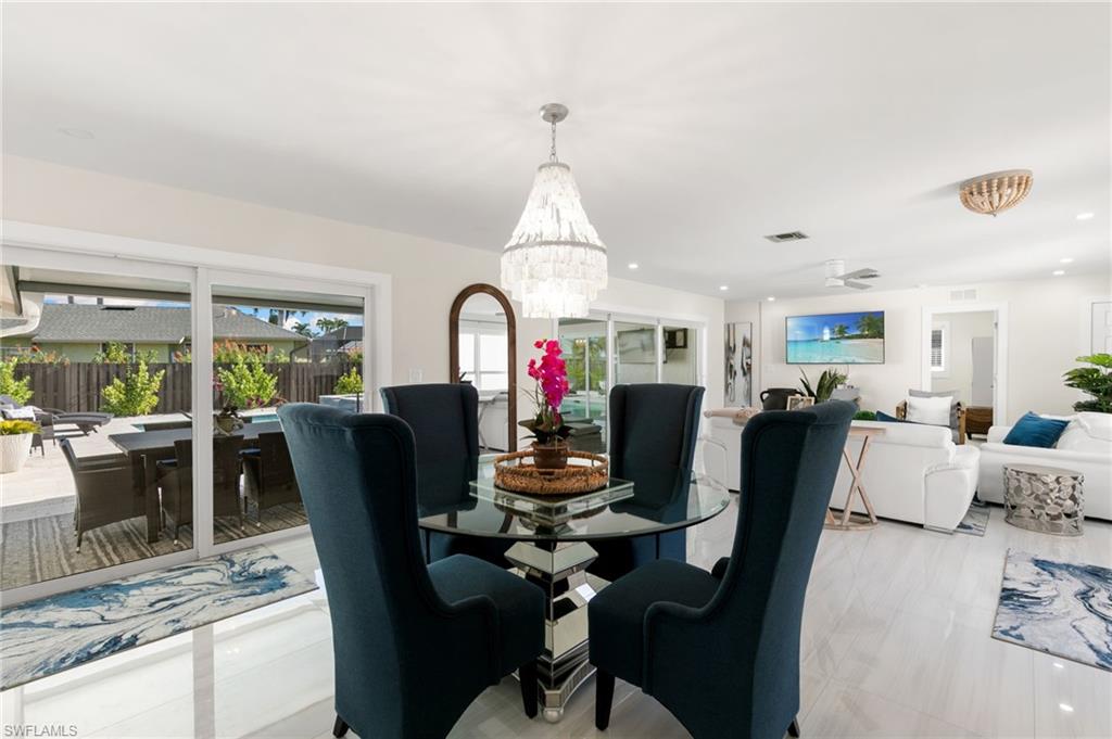 321 Columbus Way Marco Island, FL 34145 - Photo 9 of 40 Dining space with a chandelier, recessed lighting, and ceiling fan