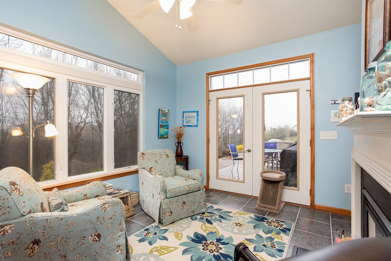 180 Ridgemore Drive Raphine, VA 24472 - Photo 19 of 68 a living room with furniture and a floor to ceiling window