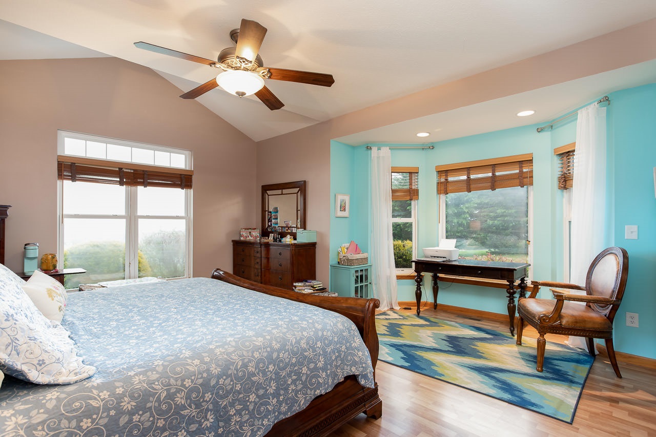 180 Ridgemore Drive Raphine, VA 24472 - Photo 20 of 68 a bedroom with a bed a chair and a large window