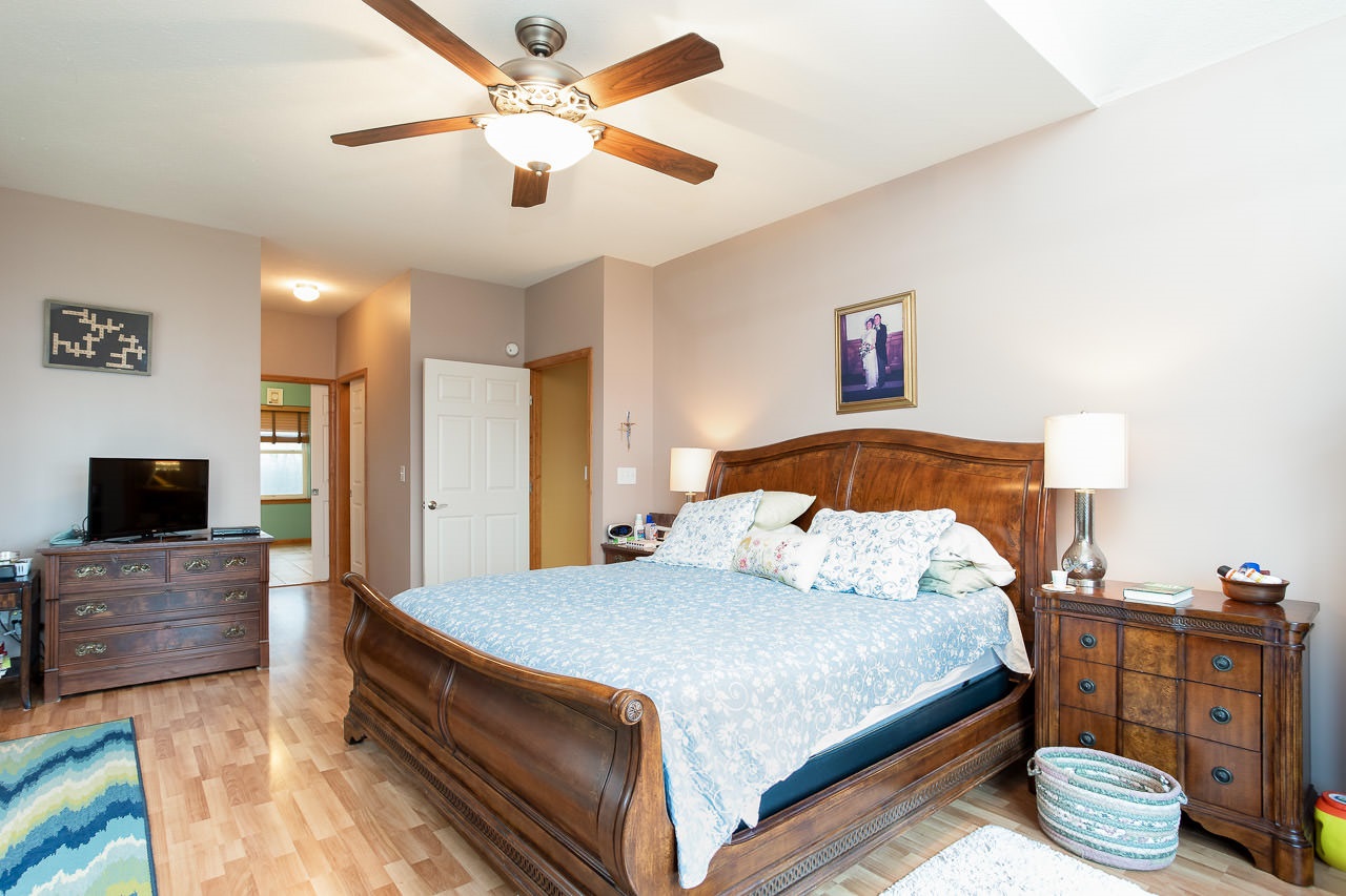 180 Ridgemore Drive Raphine, VA 24472 - Photo 22 of 68 a bedroom with a bed and a flat screen tv