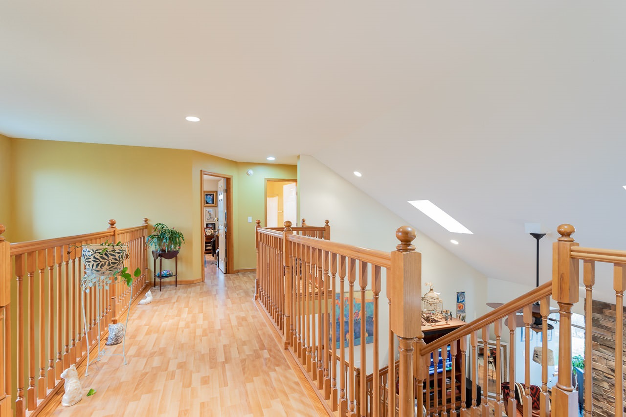 180 Ridgemore Drive Raphine, VA 24472 - Photo 30 of 68 a view of a hallway with wooden floor and stairs