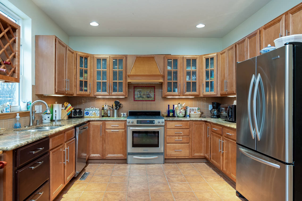 180 Ridgemore Drive Raphine, VA 24472 - Photo 3 of 68 a kitchen with stainless steel appliances granite countertop a refrigerator a sink dishwasher a stove top oven a refrigerator with island and cabinets
