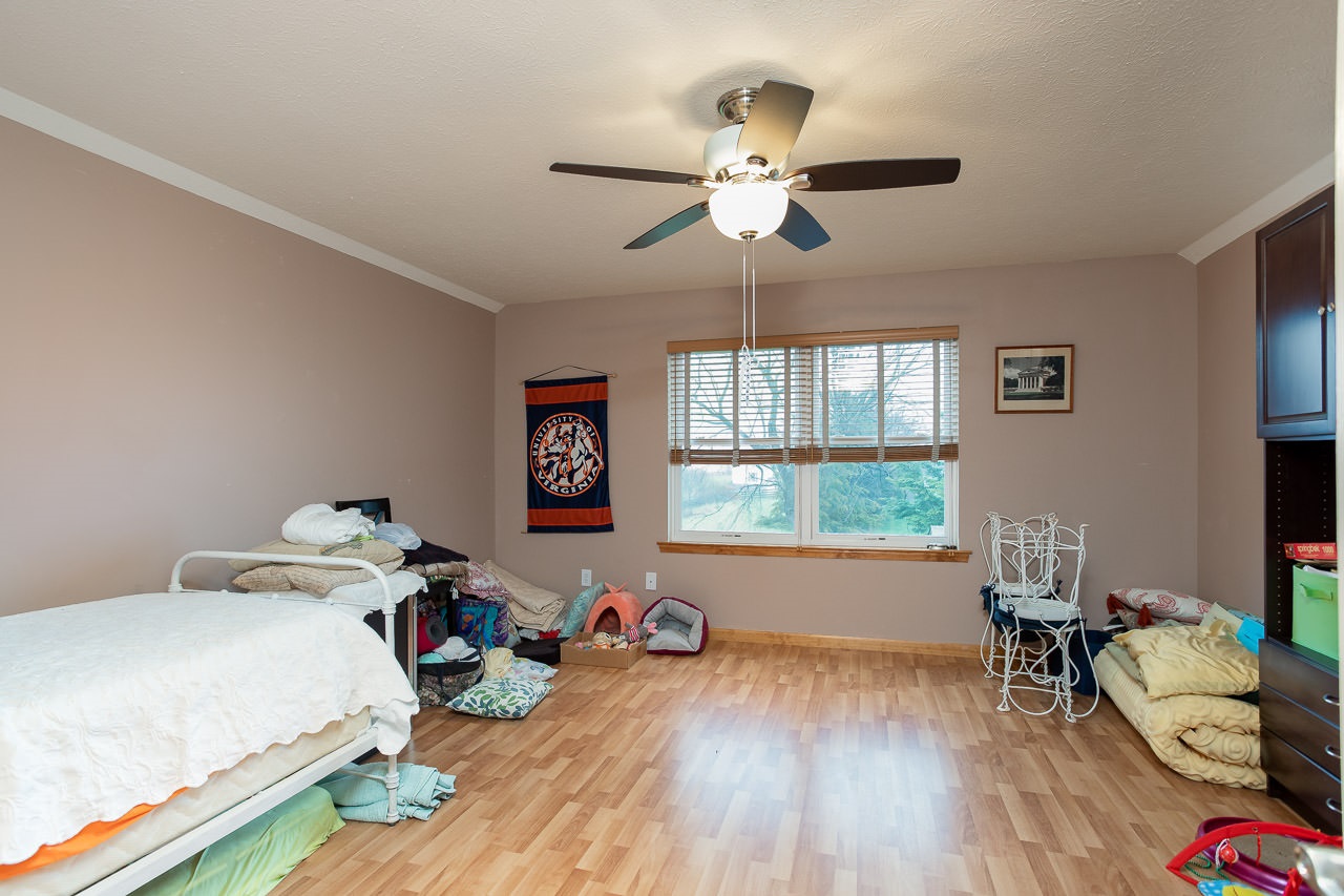 180 Ridgemore Drive Raphine, VA 24472 - Photo 31 of 68 a bedroom with furniture and a wooden floor