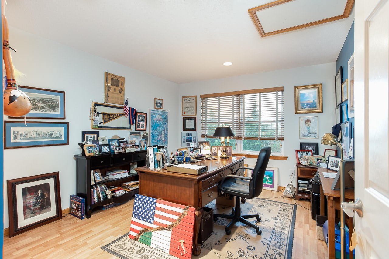 180 Ridgemore Drive Raphine, VA 24472 - Photo 33 of 68 a work room with furniture a fireplace and a flat screen tv