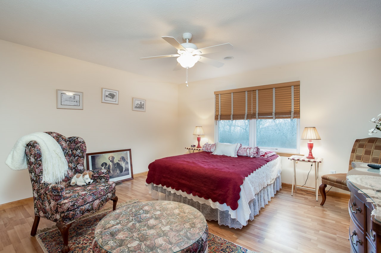 180 Ridgemore Drive Raphine, VA 24472 - Photo 36 of 68 a bedroom with two beds and a chandelier