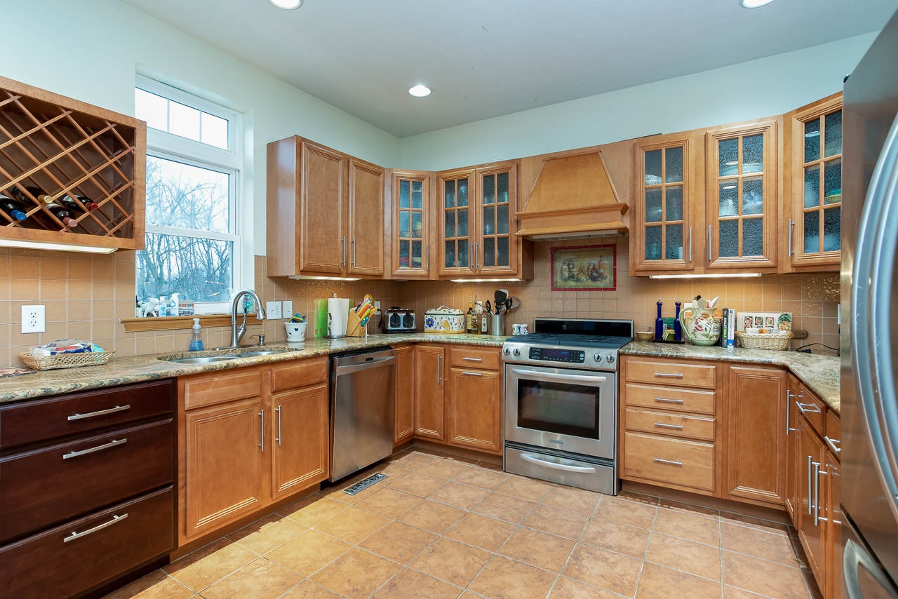 180 Ridgemore Drive Raphine, VA 24472 - Photo 4 of 68 a kitchen with stainless steel appliances granite countertop a stove and a sink