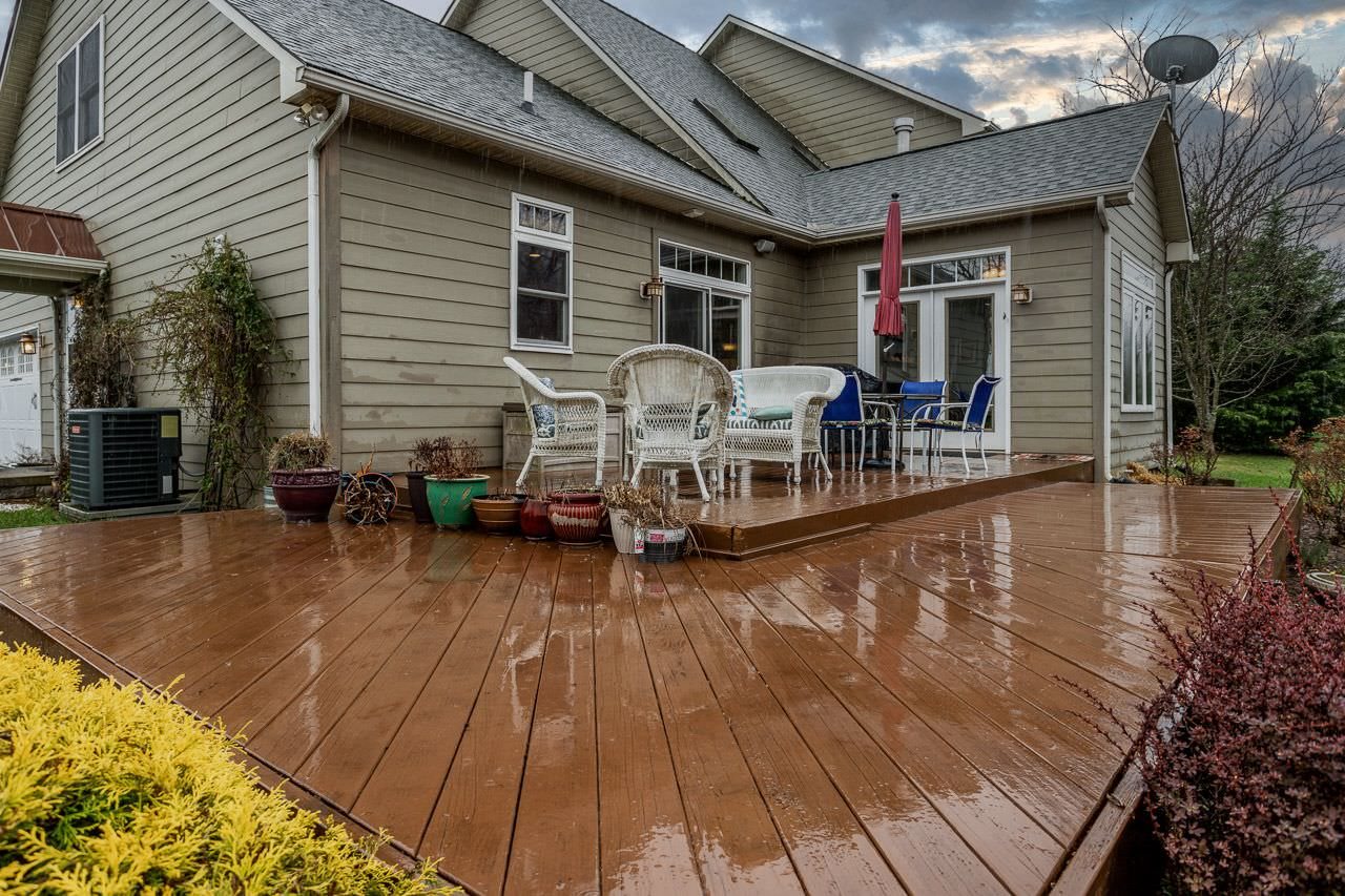 180 Ridgemore Drive Raphine, VA 24472 - Photo 47 of 68 a view of a patio with table and chairs with wooden floor and potted plants