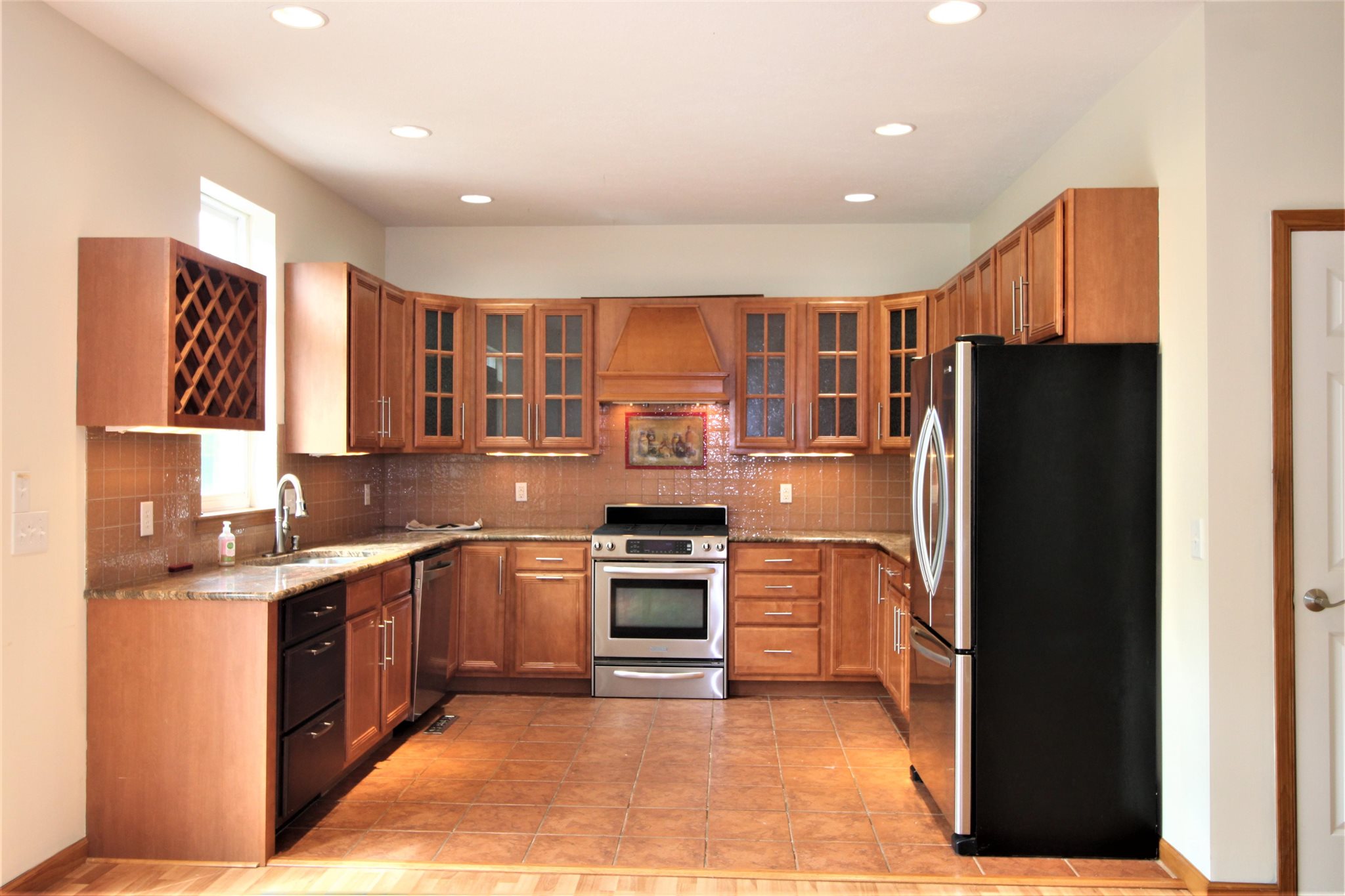 180 Ridgemore Drive Raphine, VA 24472 - Photo 57 of 68 a kitchen with stainless steel appliances granite countertop a refrigerator and a stove top oven