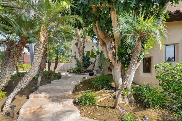 a view of a bedroom with wooden floor and entryway