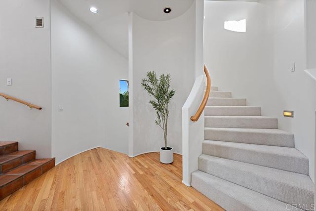 a kitchen with a sink and large window