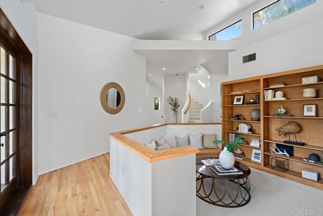 a bathroom with a granite countertop sink mirror and bathtub
