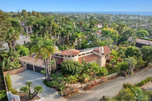 an aerial view of a house with a garden