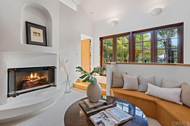 a white bath tub sitting in a bathroom next to a window