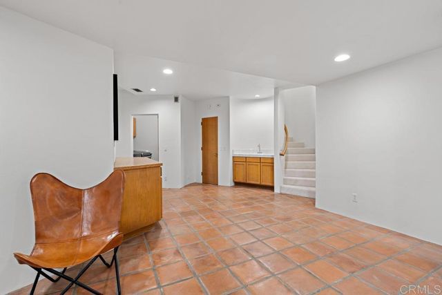 a view of a house with a yard and a garden