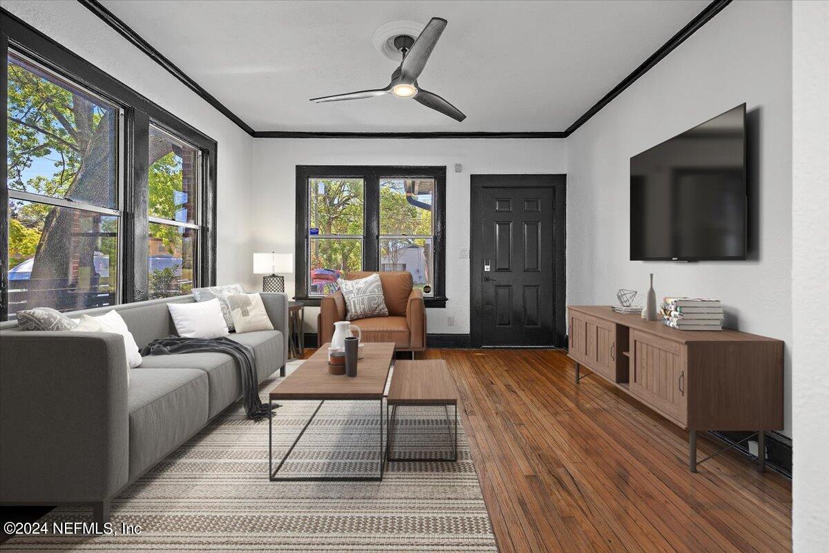 2015 Reed Avenue Jacksonville, FL 32207 - Photo 5 of 27 a living room with furniture a flat screen tv and large windows