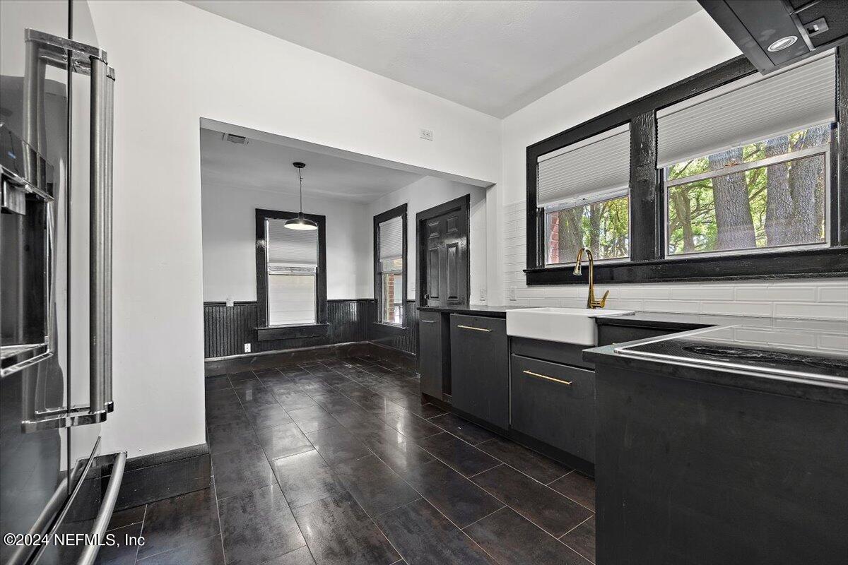 2015 Reed Avenue Jacksonville, FL 32207 - Photo 7 of 27 a kitchen with sink refrigerator and window