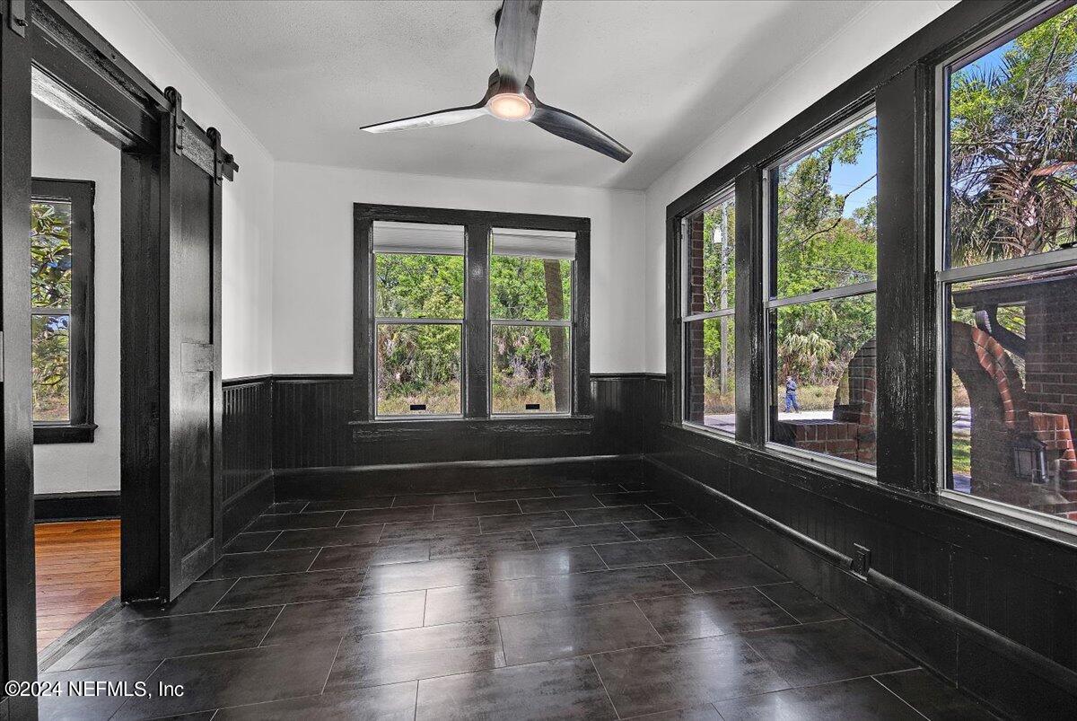 2015 Reed Avenue Jacksonville, FL 32207 - Photo 10 of 27 a view of an empty room with wooden floor and a window