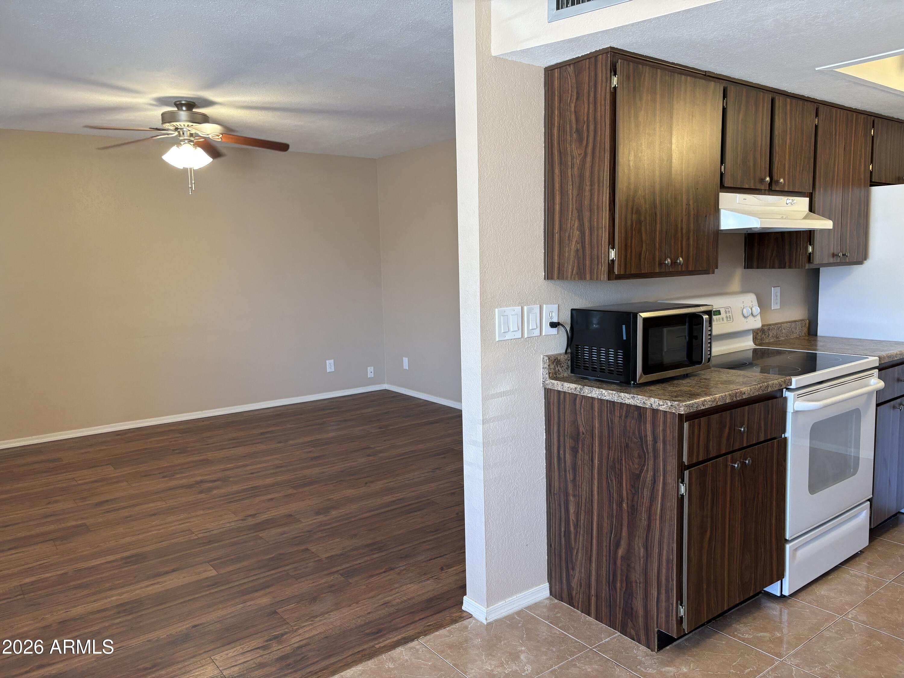 9626 West Mountain View Road, Unit A Peoria, AZ 85345 - Photo 10 of 28 kitchen-living room