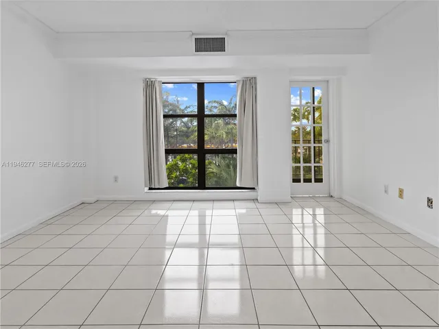 an empty room with glass door