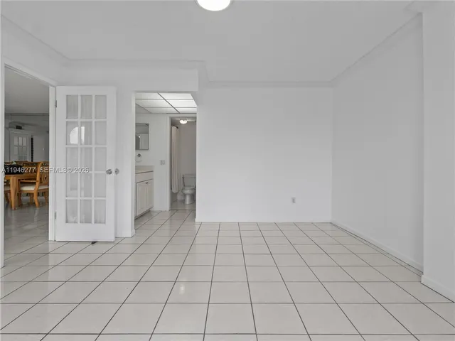a bathroom with a double vanity sink toilet and a mirror