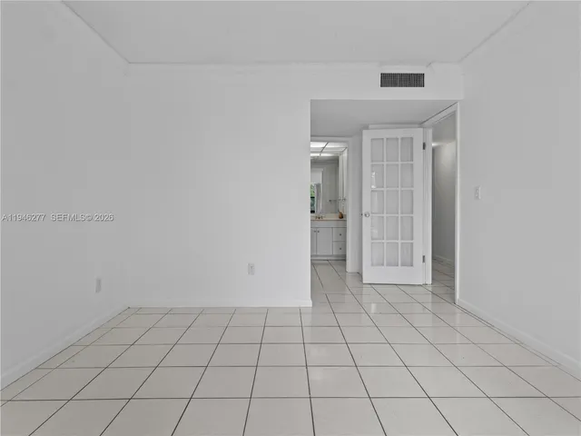 a bathroom with a shower sink and mirror