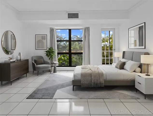a spacious bedroom with a bed and glass window