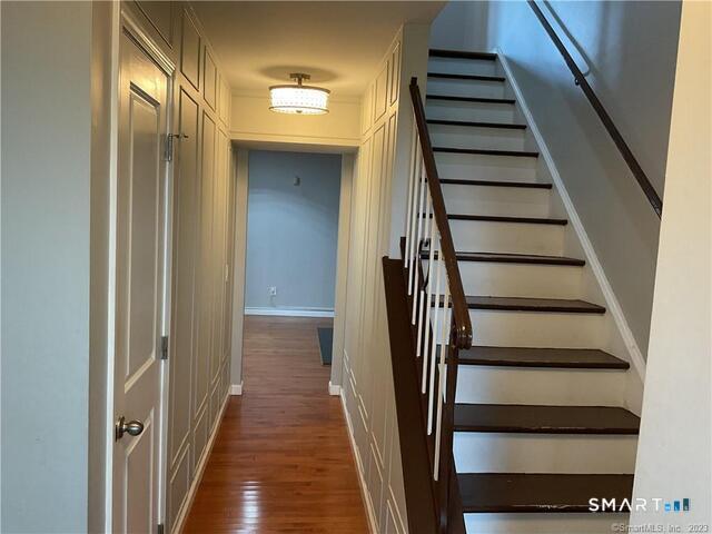 25 Padanaram Road, Unit 84 Danbury, CT 06811 - Photo 13 of 34 a view of entryway and gallery with wooden floor