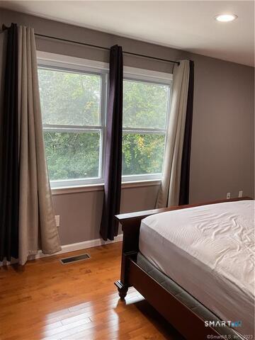 25 Padanaram Road, Unit 84 Danbury, CT 06811 - Photo 16 of 34 a bedroom with a bed and a window