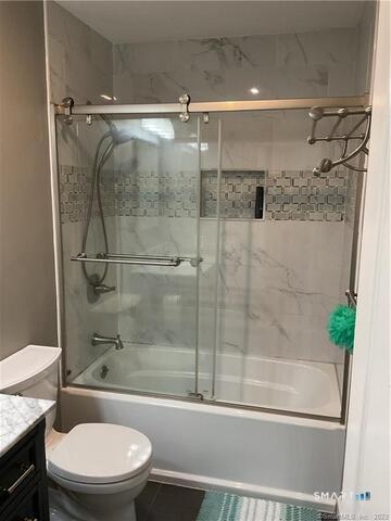 25 Padanaram Road, Unit 84 Danbury, CT 06811 - Photo 23 of 34 a bathroom with a shower and a toilet