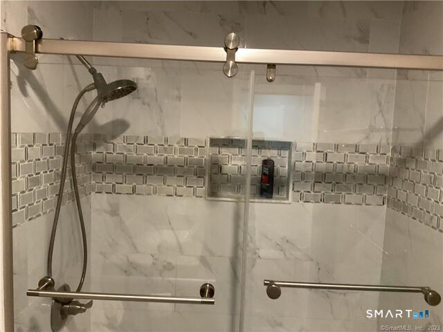25 Padanaram Road, Unit 84 Danbury, CT 06811 - Photo 24 of 34 a bathroom with a shower