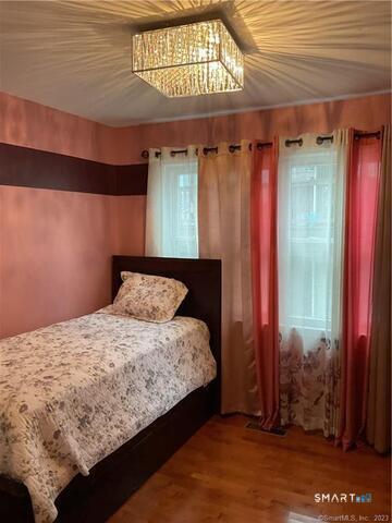 25 Padanaram Road, Unit 84 Danbury, CT 06811 - Photo 30 of 34 a bedroom with a bed and a window