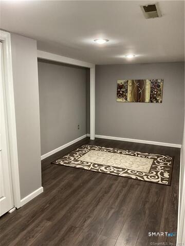 25 Padanaram Road, Unit 84 Danbury, CT 06811 - Photo 31 of 34 a view of a room with wooden floor