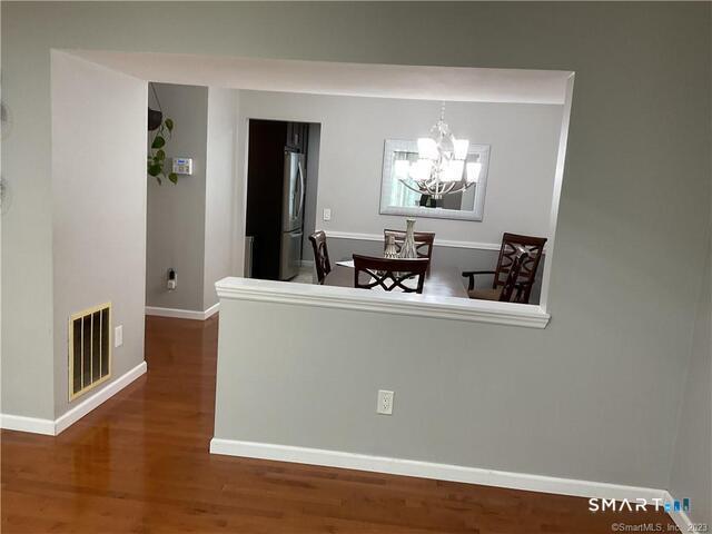 25 Padanaram Road, Unit 84 Danbury, CT 06811 - Photo 6 of 34 a view of livingroom with furniture and wooden floor