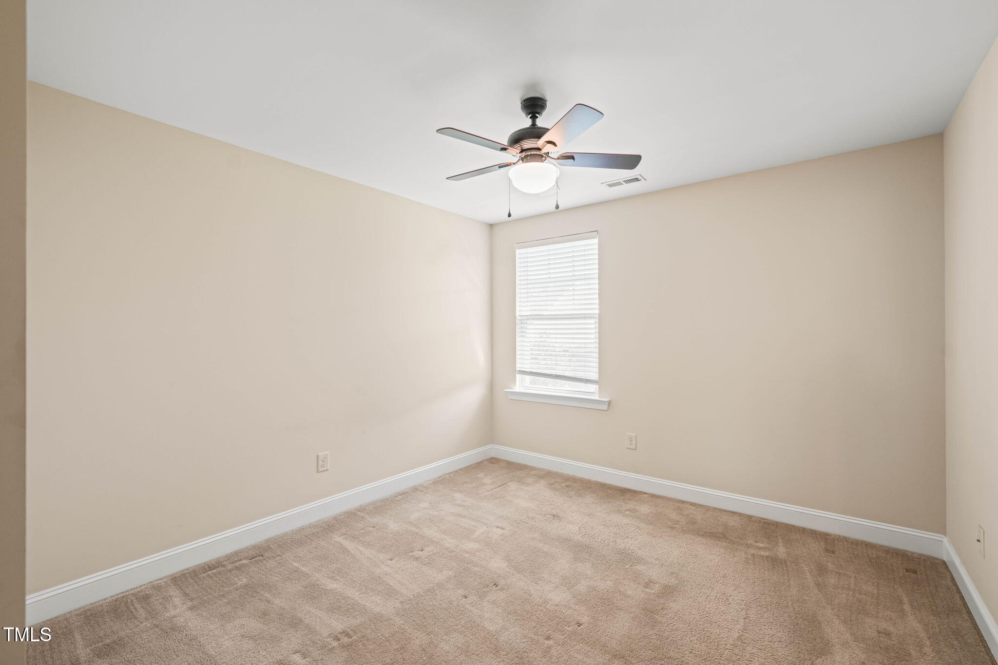 4508 Brintons Cottage Street Raleigh, NC 27616 - Photo 29 of 46 an empty room with windows and fan