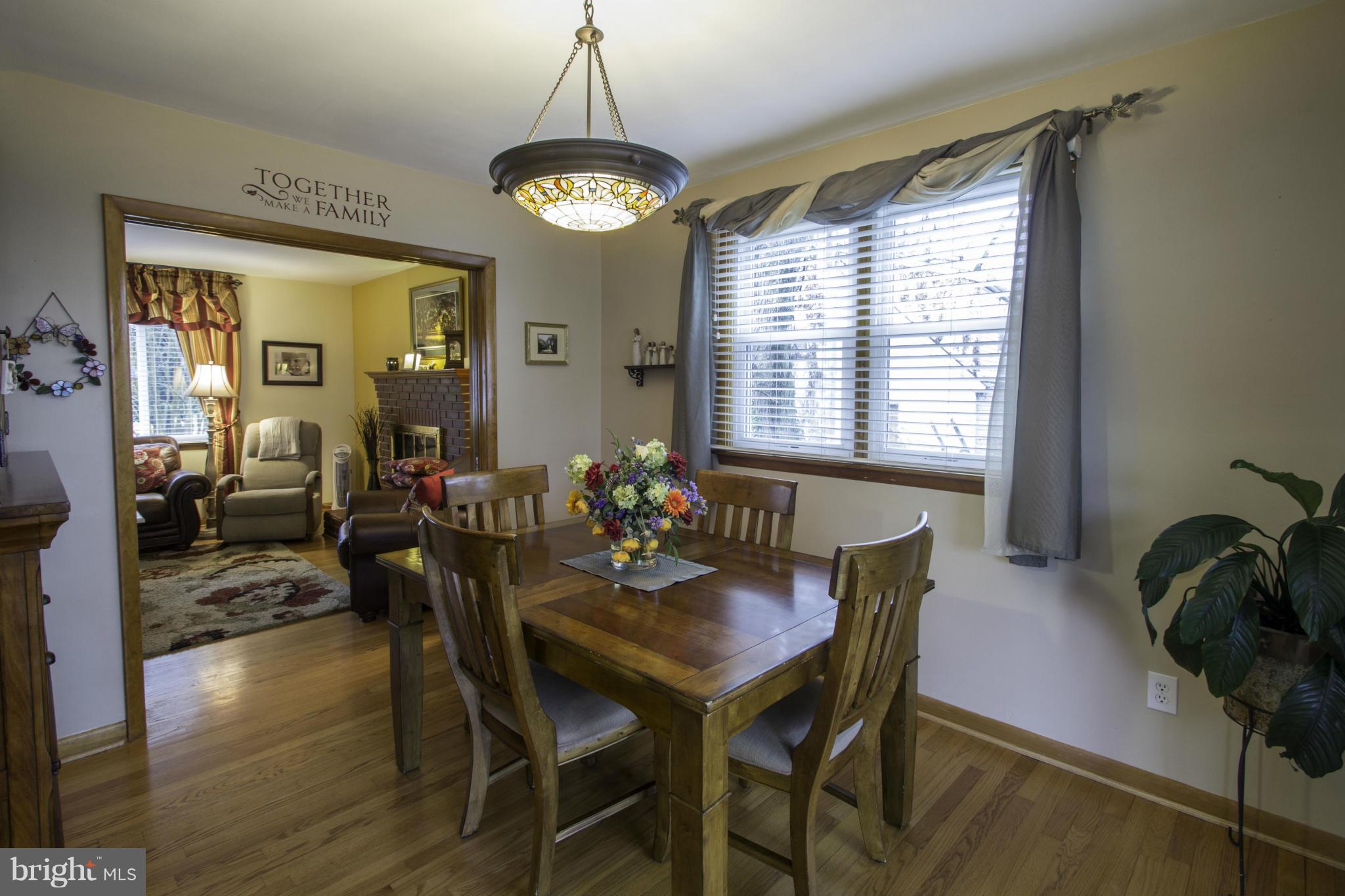 210 North Hammonds Ferry Road Linthicum, MD 21090 - Photo 8 of 30 a view of a dining room with furniture window and wooden floor
