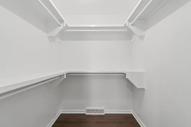 a view of an empty walk in closet