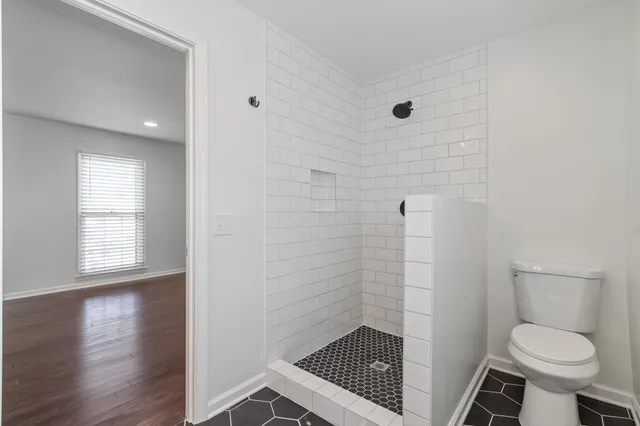 a bathroom with a toilet and a sink