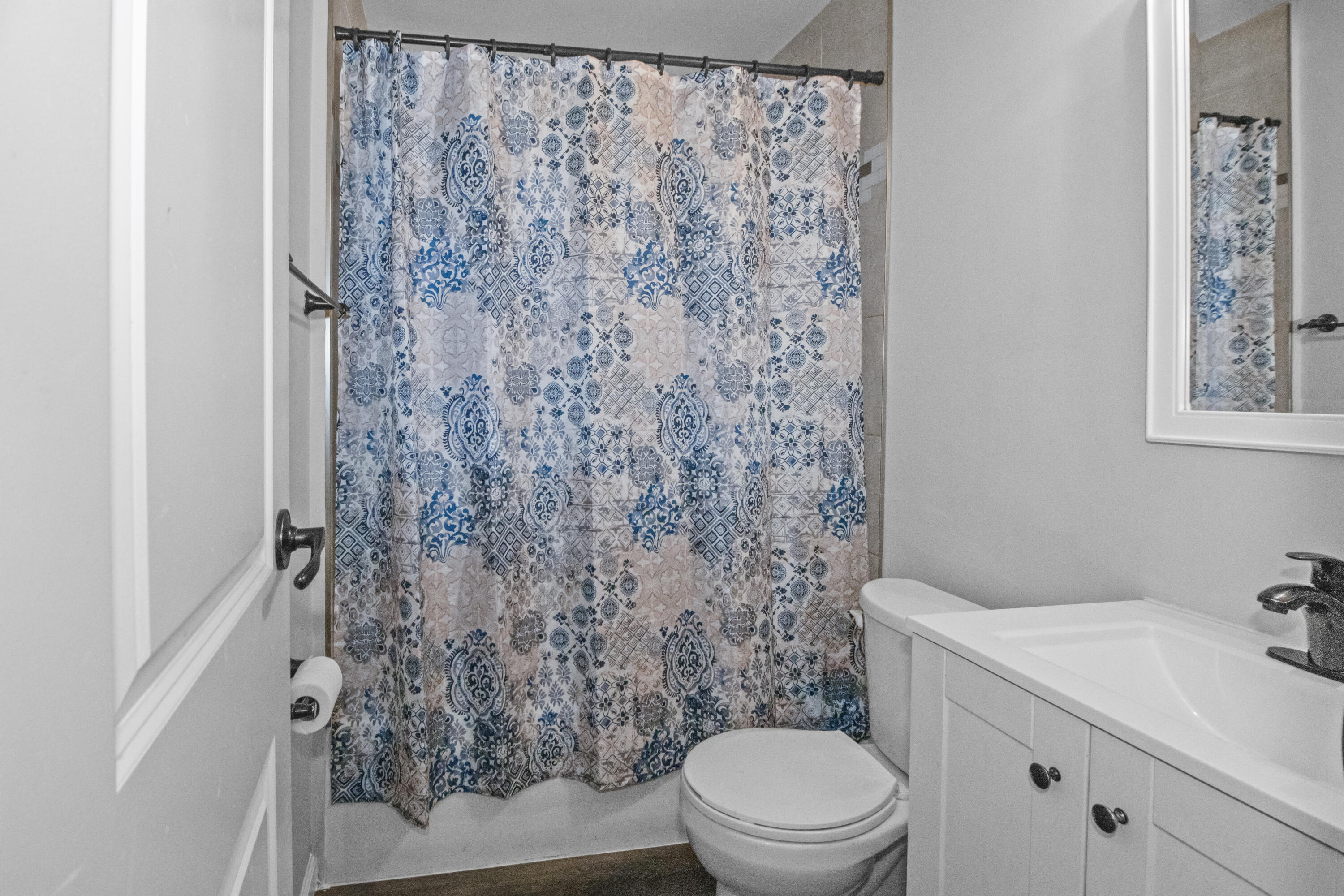 309 Michigami Trail Porter, IN 46304 - Photo 18 of 21 a bathroom with a toilet and a shower curtain