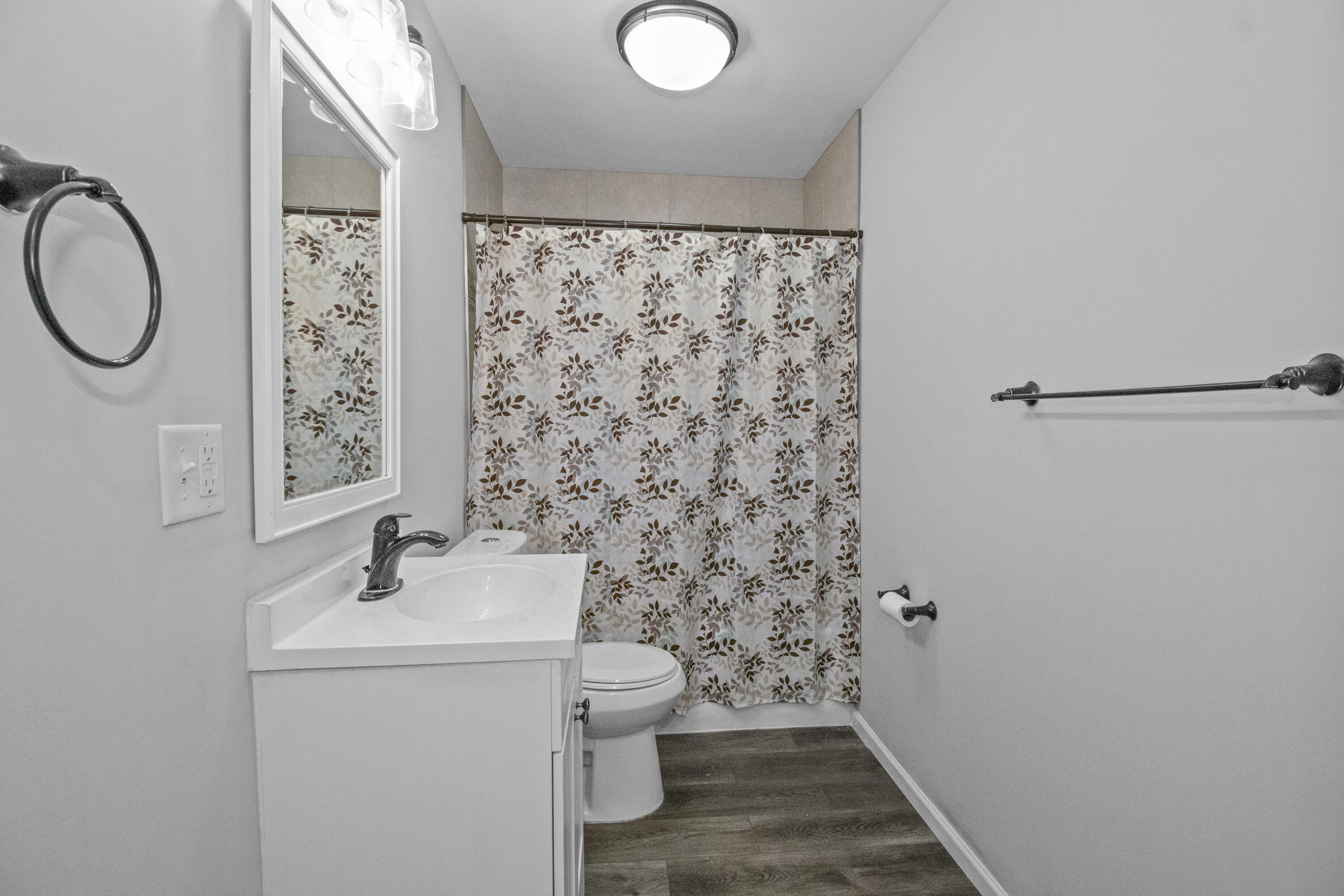 309 Michigami Trail Porter, IN 46304 - Photo 19 of 21 a bathroom with a sink a toilet and a mirror