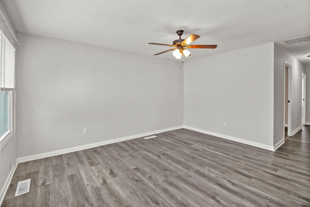 309 Michigami Trail Porter, IN 46304 - Photo 4 of 21 a view of a room with wooden floor and a ceiling fan