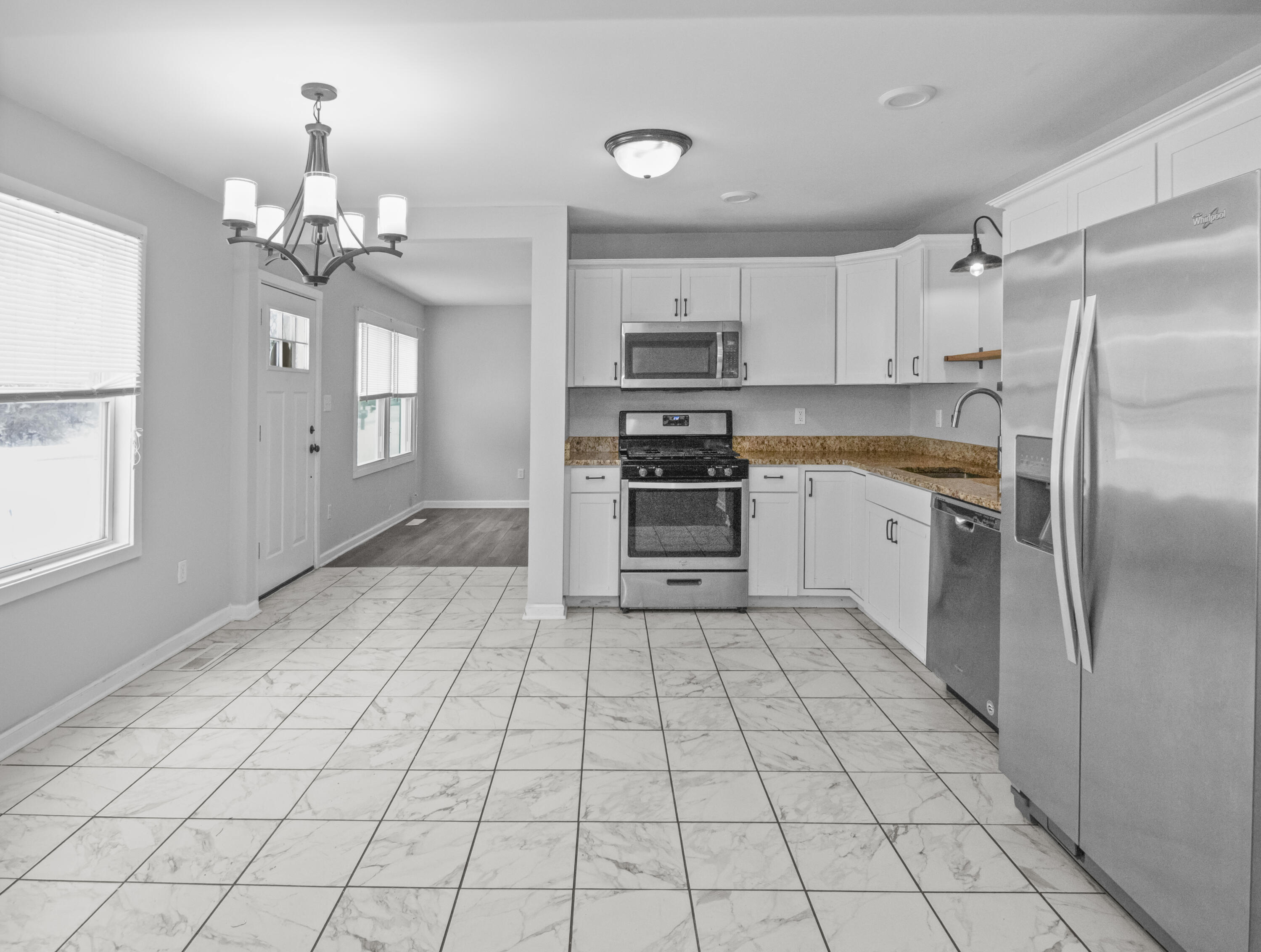 309 Michigami Trail Porter, IN 46304 - Photo 5 of 21 a kitchen with stainless steel appliances a sink and a refrigerator