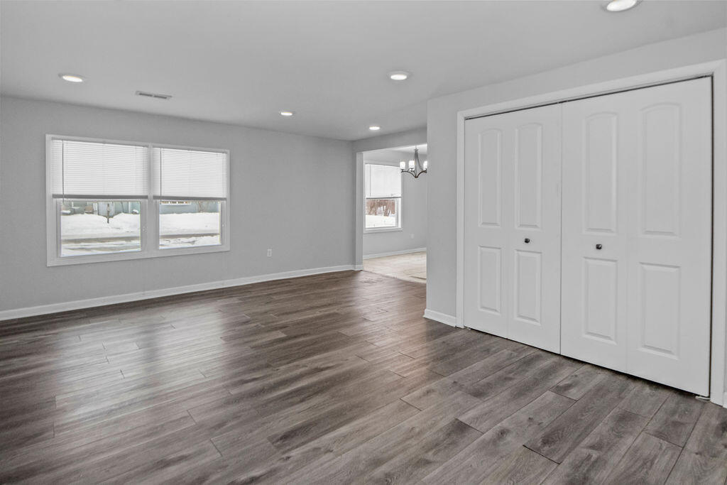 309 Michigami Trail Porter, IN 46304 - Photo 9 of 21 wooden floor in an empty room with a window