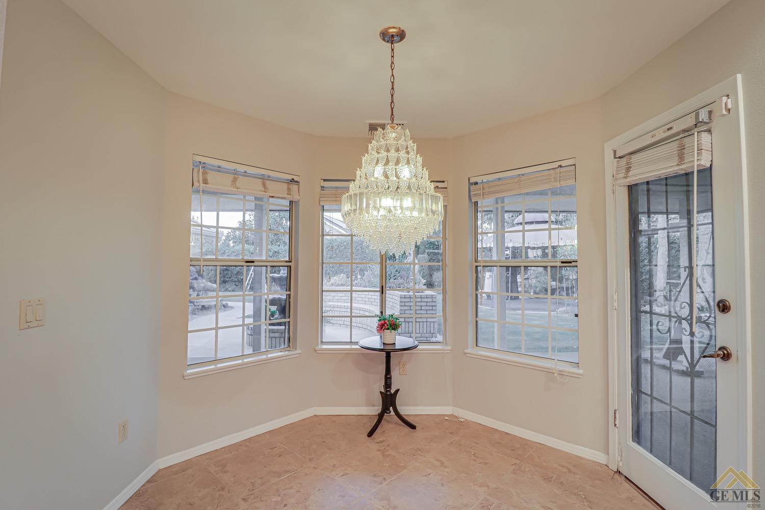Undisclosed Address Bakersfield, CA 93314 - Photo 13 of 38 a living room with hardwood floor and windows