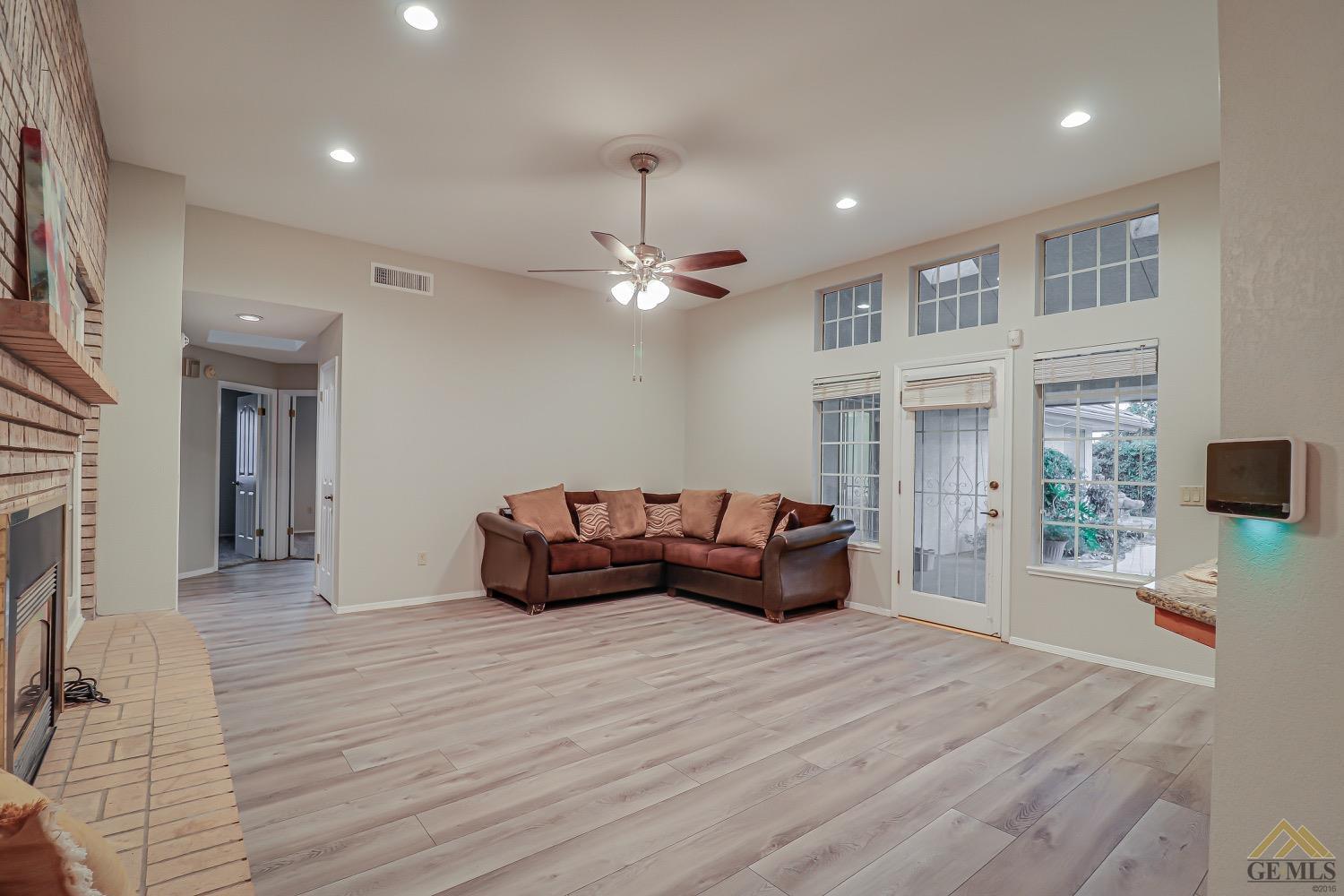 Undisclosed Address Bakersfield, CA 93314 - Photo 17 of 38 a living room with furniture and a large window