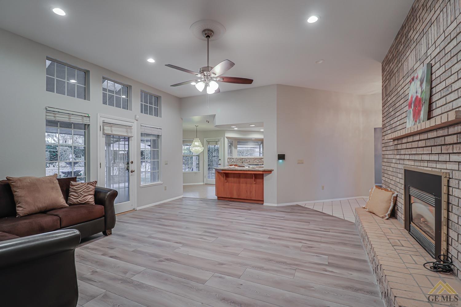 Undisclosed Address Bakersfield, CA 93314 - Photo 18 of 38 a living room with furniture and a fireplace