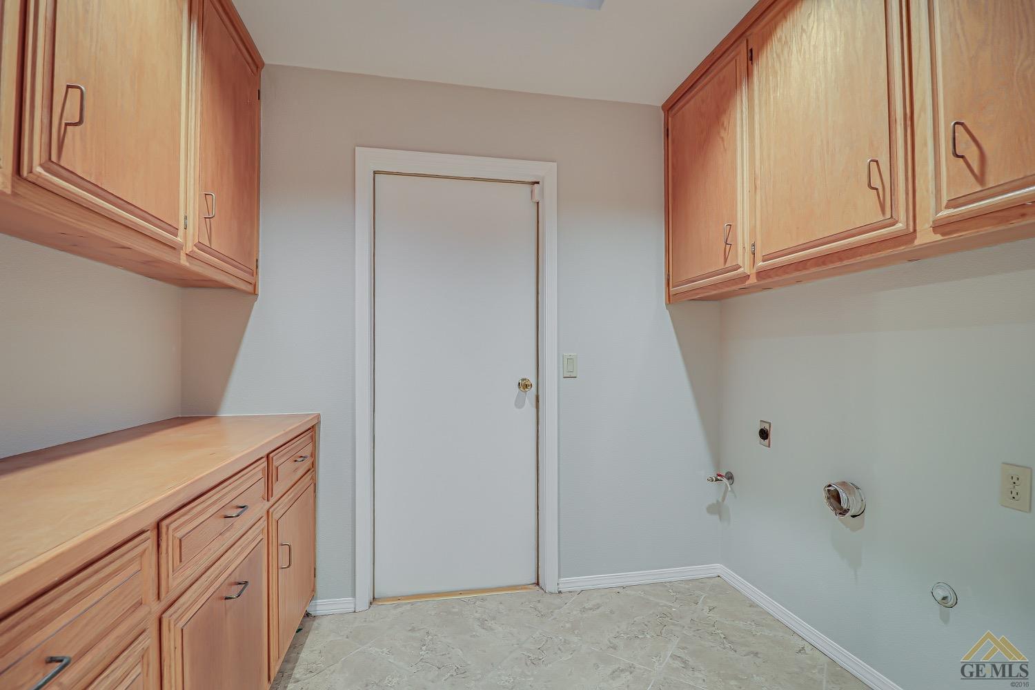 Undisclosed Address Bakersfield, CA 93314 - Photo 20 of 38 a view of cabinets with wooden floor