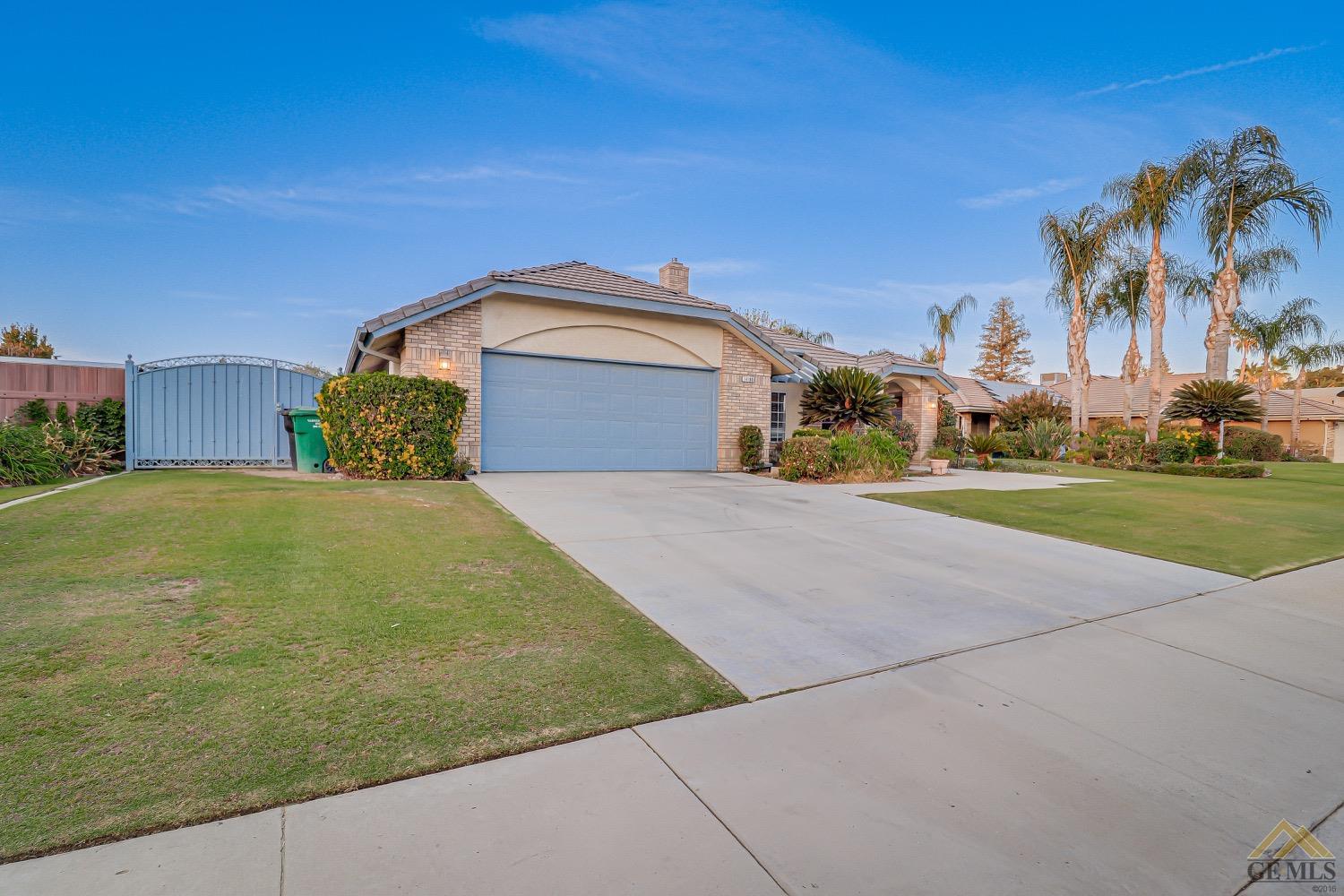 Undisclosed Address Bakersfield, CA 93314 - Photo 2 of 38 a front view of a house with a yard