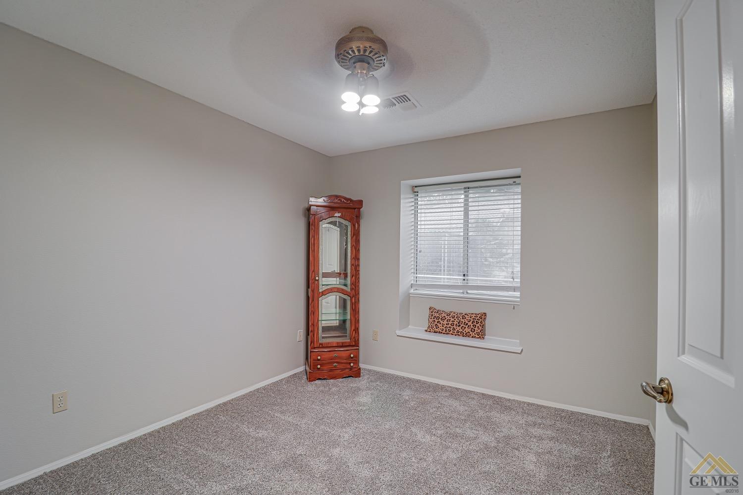 Undisclosed Address Bakersfield, CA 93314 - Photo 21 of 38 an empty room with windows and closet